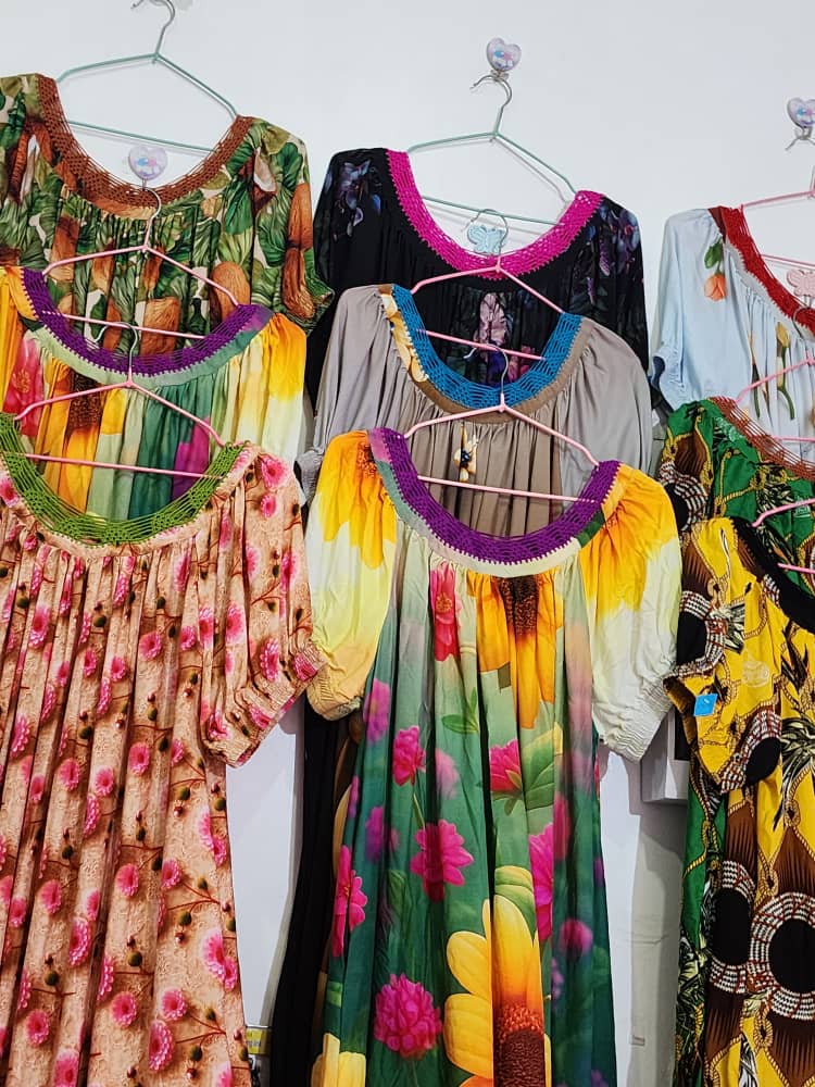 Multi-colour dresses on hangers