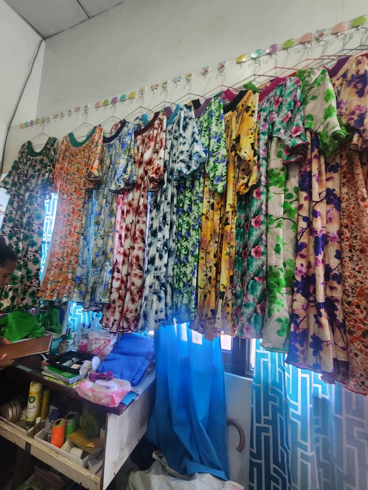 Row of green floral dresses