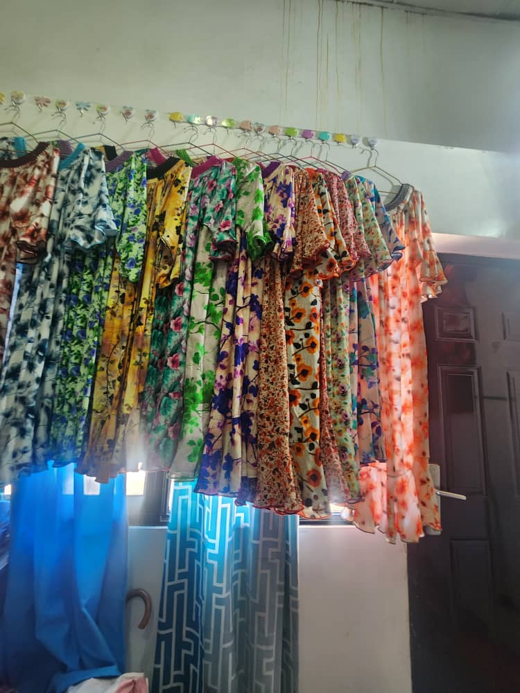 Full rack of colourful floral dresses